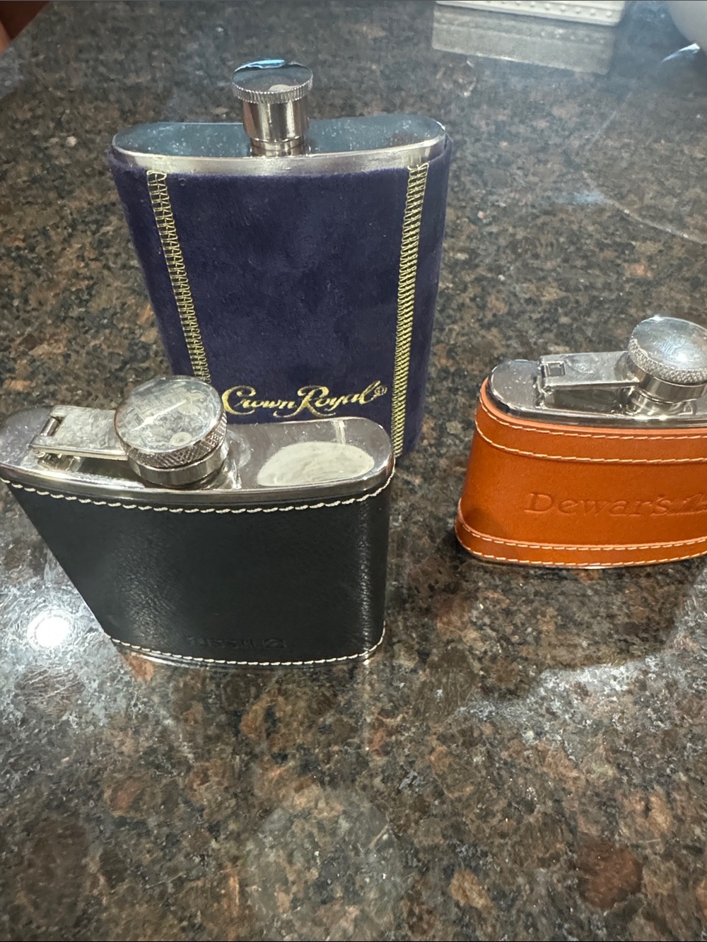 Purple Crown Flask, Black Leather Flask and Brown Leather Flask.